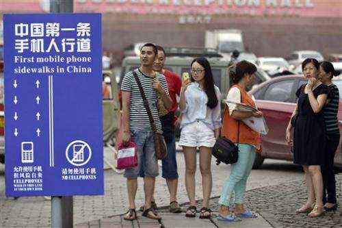 Chinese city creates cellphone sidewalk lane