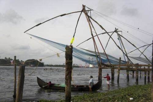 Chinese fishing nets hang over the water in Kochi, Kerala, September 12, 2014. But the Indian town now depends on tourists not f