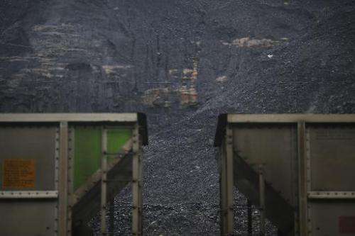 Coal harvested from a strip mine sits behind a pair of coupled coal cars on June 3, 2014 in Printer, Kentucky