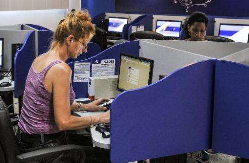 Cubans gather at a cybercafe in Havana on June 21, 2013