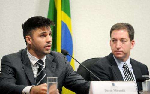 David Miranda (L), partner of the Guardian's Brazil-based reporter Glenn Greenwald (R), speaks before the investigative committe