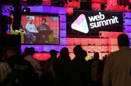 Delegates attend one of the many live talks at the Web Summit in Dublin, Ireland, on November 6, 2014