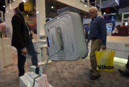 Ecovacs presents Winbot, a window cleaning robot, during the 2014 International CES at the Las Vegas Convention Center on Januar