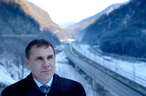 Environmental Watch ecology group activist Yevgeny Vitishko, standx in front of the new road between Adler and Krasnaya Polyana 