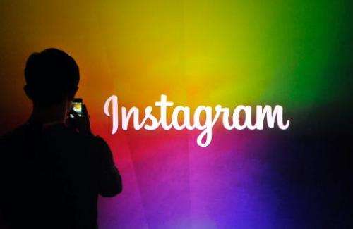 Facebook-owned photo sharing service Instagram said it has landed its first deal with a major ad agency
