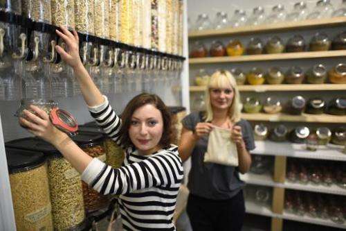 Founders of the 'Original Unverpackt OU' ('originally unpacked') shop, Milena Glimbovski (front) and Sara Wolf pose for a photo 