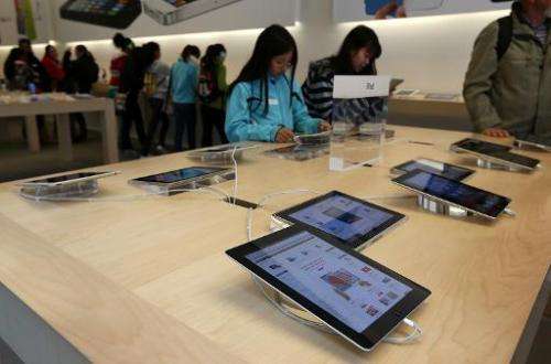 Fourth generation Apple iPads are seen on display at an Apple store on February 5, 2013 in San Francisco, California