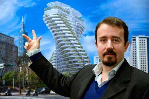 French architect Vincent Callebaut poses as he presents a picture of one of his futuristic projects on January 10, 2014 in Paris
