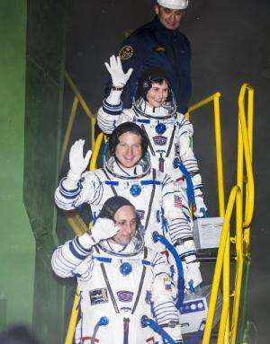 (From top) Expedition 42 Flight Engineer Samantha Cristoforetti, Flight Engineer Terry Virts, and Soyuz Commander Anton Shkapler