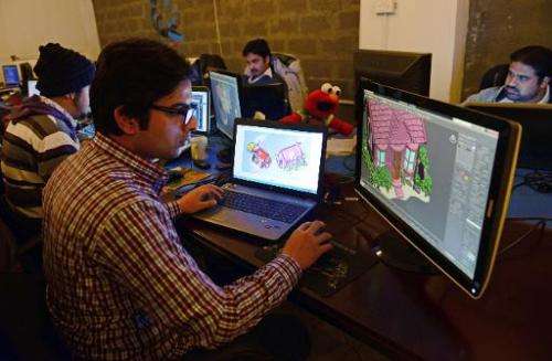 Game designers work at their studio 'We R Play', in Islamabad, on January 21, 2014