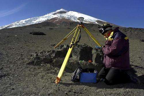 Geologist Bolivar Caceres places Differencial GPS equipment on the Cotopaxi volcano in Ecuador, on January 3, 2004