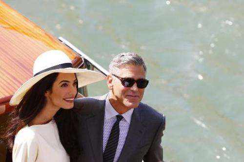 George Clooney and Amal Alamuddin in Venice on September 29, 2014 after a civil ceremony to officialise their wedding