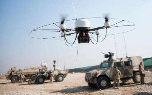 German Bundeswehr soldiers fly a Mikado drone at Camp Marmal in Mazar-e-Sharif, Afghanistan, on December 23, 2013