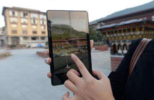 Google product communications manager Stephanie Shih demonstrates a Google Street View of Thimphu, on October 23, 2014