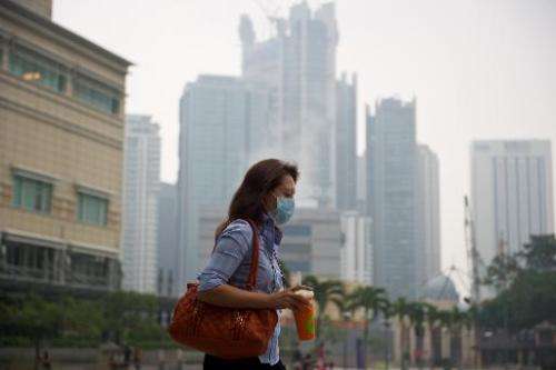 Haze shrouds Kuala Lumpur and surrounding areas, causing 'unhealthy' air quality due to fires from a drought
