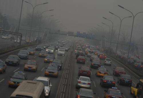 Heavy traffic is seen on the second ring road as air pollution continues to shroud Beijing, on February 26, 2014