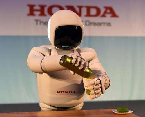 Honda North America makes their North American debut of their new Asimo Robot as it demonstrates its ability to pour a liquid at