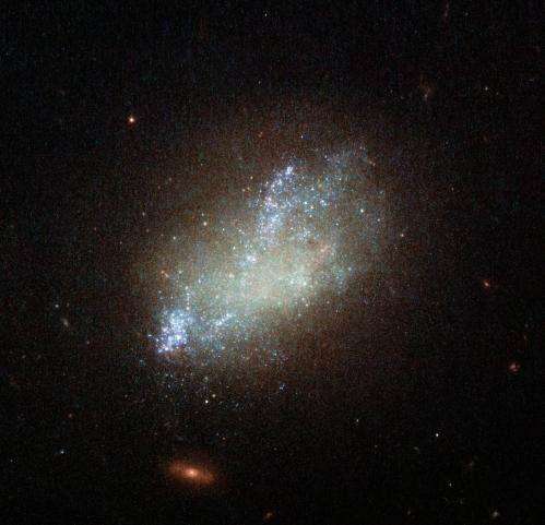 Hubble paints a spattering of blue in irregular galaxy IC 559