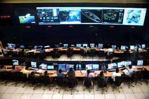 Indian scientists and engineers of Indian Space Research Organization (ISRO) monitor the Mars Orbiter Mission (MOM) at the track