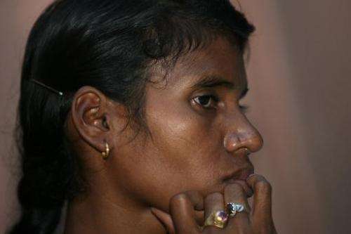 Indian villager Phulme Majhi gestures as she attends a press conference in New Delhi to highlight the environmental impact on he
