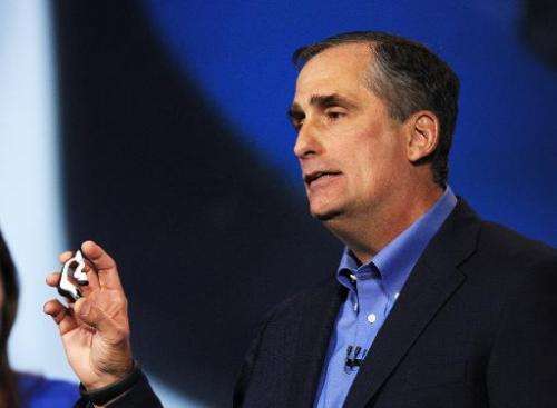 Intel Corp. CEO Brian Krzanich displays the Intel smart headset and earbud designs, providing full stereo audio, heart rate moni
