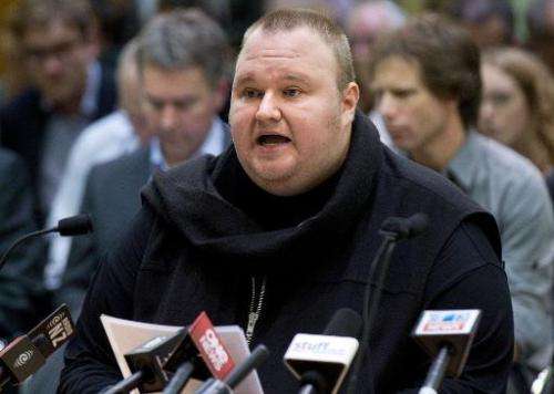 Internet mogul Kim Dotcom speaks at a meeting with New Zealand Prime Minister John Key at Bowen House in Wellington on July 3, 2