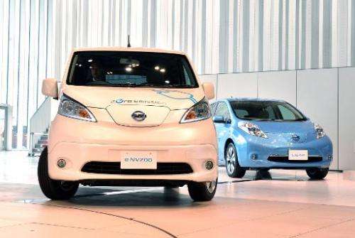 Japanese auto maker Nissan Motor's electric vehicles &quot;e-NV200&quot; (L) and &quot;Leaf&quot; are pictured on June 9, 2014 a