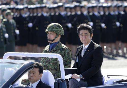 Japan OKs easing of military-related exports
