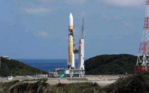 Japan's H-IIA rocket moves to the lauching pad at the Japan Aerospace Exploration Agency (JAXA) Tanegashima Space Center in Kago