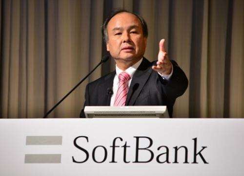 Japan's SoftBank Corp. founder and President Masayoshi Son holds a press briefing in Tokyo on February 12, 2014