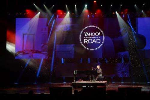 John Legend performs during the keynote address by Yahoo CEO Marissa Mayer at  the 2014 International CES in Las Vegas, Nevada, 