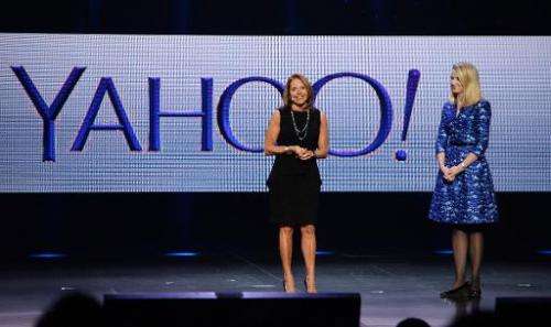 Katie Couric (L) appears on stage with Yahoo CEO Marissa Mayer during Mayer's keynote address at  the 2014 International CES in 