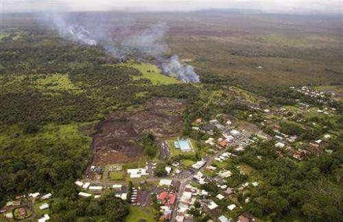 Lava burns shed, creeps toward homes in Hawaii