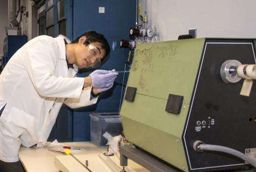 Material scientist exploring ways to improve efficiency of solar cells