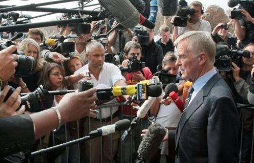 Max Mosley answers journalists' questions as he leaves FIA headquarters in Paris on September 21, 2009