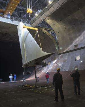 NASA aces delicate operation with aircraft tail