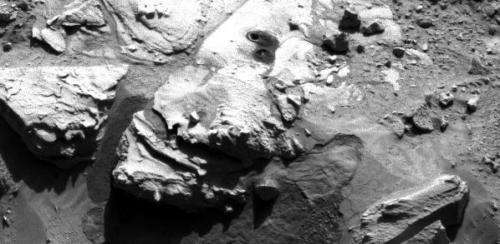 Nasa's Curiosity rover drills sandstone slab on Mars