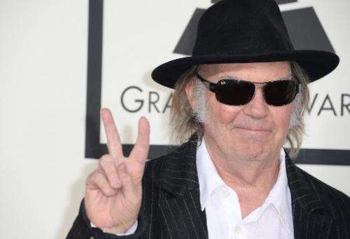 Neil Young arrives on the red carpet for the Grammy Awards at the Staples Center in Los Angeles, California on January 26, 2014