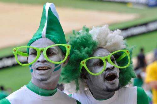 Nigeria fans pose at the 2013 African Cup of Nations final football match against Burkina Faso, on February 10, 2013 in Johannes