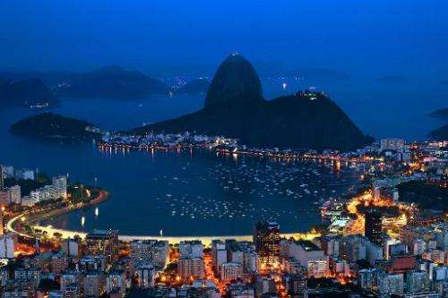 Night view of the Guanabara bay with the Sugar Leaf hill in the background (C) in Rio de Janeiro on October 30, 2012, Brazil