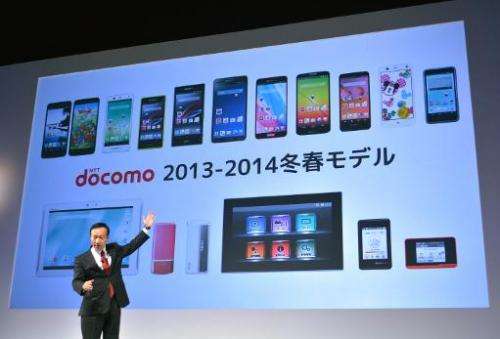 NTT Docomo's president Kaoru Kato speaks during a press briefing to announce the company's 2013/14 winter/spring models in Tokyo