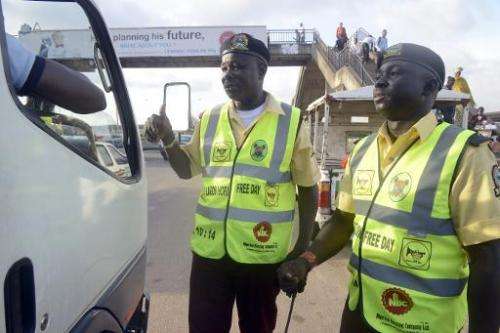 Officers of the Lagos State Traffic Management Authority (LASTMA) speak to a motorist about the use of car horn in Lagos on Octo