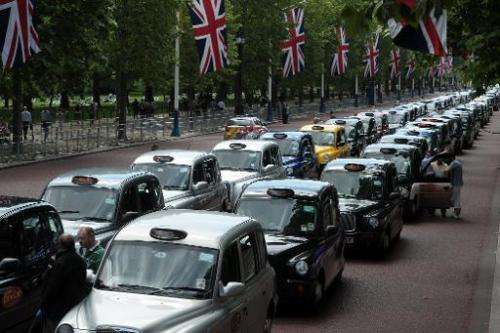 Parked taxis block the Mall leading to Buchingham Palace during a protest by London black cab drivers against private taxi servi