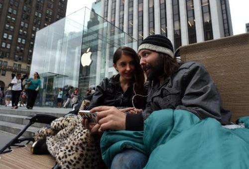 People wait in line September 9, 2014 outside the Apple Store in New York