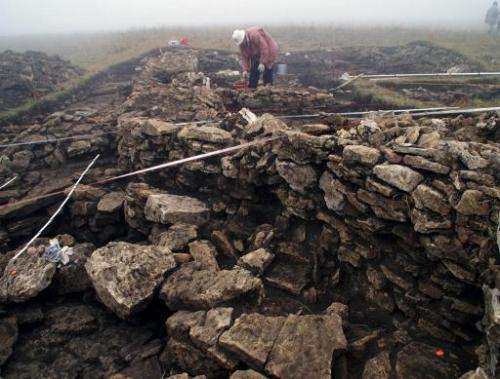 People work on an excavation site in the mountains south of Kislovodsk, Russia in October, 2009