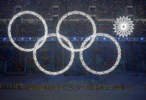 Performers sing as the Olympic rings are presented during the Opening Ceremony of the Sochi Winter Olympics, at the Fisht Olympi