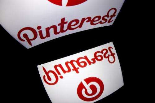 Pinterest's mobile app logo is displayed on a tablet on January 2, 2014 in Paris