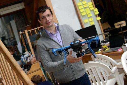 Project engineer Antoine Level shows a drone prototype named Hexo+ on July 2, 2014 in  France