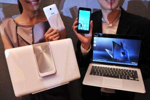 Promoters display the new &quot;ASUS Transformer Book V&quot; by Taiwanese electronics company ASUS during a press conference ah