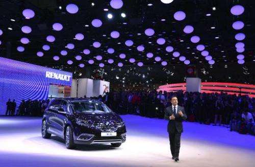 Renault CEO Carlos Ghosn presents the new Renault Espace 5 at the 2014 Paris Auto Show in Paris on October 2, 2014